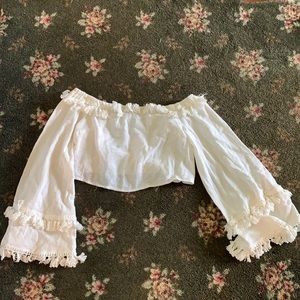 showpo cropped off the shoulder boho-tassel shirt